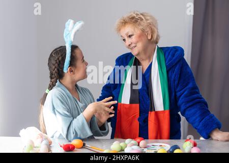grandmother and granddaughter with uae flag for easter Stock Photo