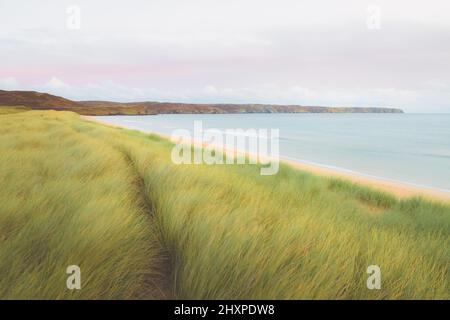 Scenic seascape landscape of Traigh Mhor Beach and grassy dunes at North Tolsta on the Isle of Lewis and Harris in the Outer Hebrides of Scotland, UK. Stock Photo