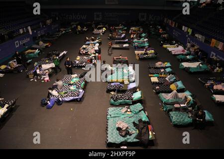 KRAKOW, POLAND - MARCH 9, 2022: Ukrainian refugees at the Suche Stawy (football club Hutnik Krakow Arena) in Cracow Stock Photo