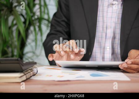 businessman using digital tablet on office desk  Stock Photo