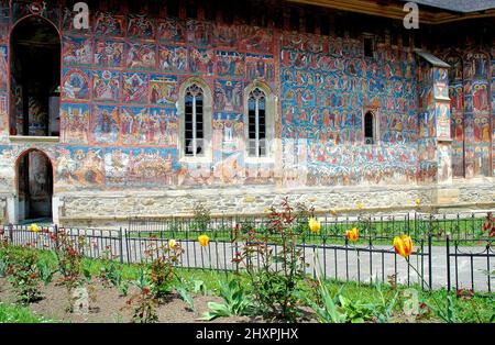 Moldovitsa Monastery, Suceava County, Moldavia, Romania: One of the famous painted churches of Moldavia. Medieval frescoes and garden. Stock Photo