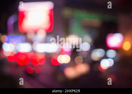 Blurred street lights, urban abstract background. defocused image of night city. Vehicles on the road Stock Photo