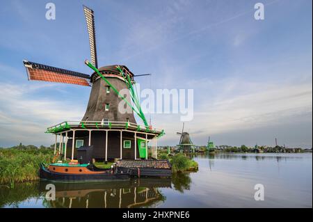 An old Dutch Windmill in the village of Zaanse Schaans Stock Photo