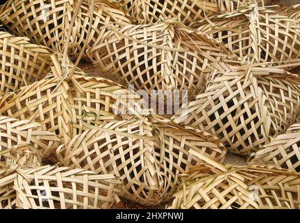 Close up of rattan bamboo weave handmade bird cage with bird inside for sale in the Asian local fresh market Stock Photo