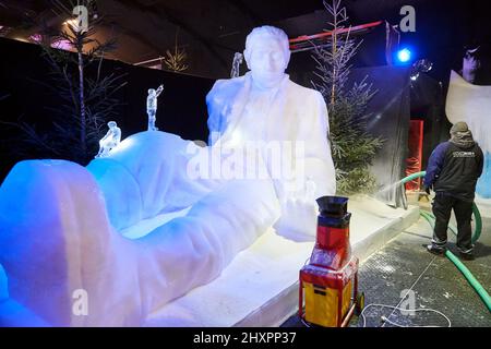 Giant ice sculpture of the character Gulliver in Lilliput Stock Photo