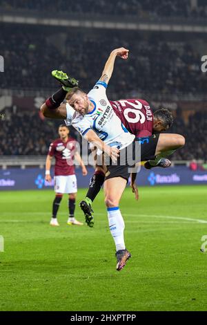 Turin, Italy. 13th Mar, 2022. Milan Skriniar (37) of Inter and Koffi Djidji (26) of Torino seen in the Serie A match between Torino and Inter at Stadio Olimpico in Torino. (Photo Credit: Gonzales Photo/Alamy Live News