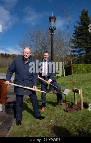 robbie-butler-mla-right-and-william-humphrey-mla-plant-a-tree-at