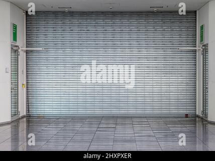 closed roller shutter at a shop without people Stock Photo