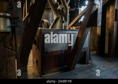 Interior shot of an old historic factory with machinery Stock Photo