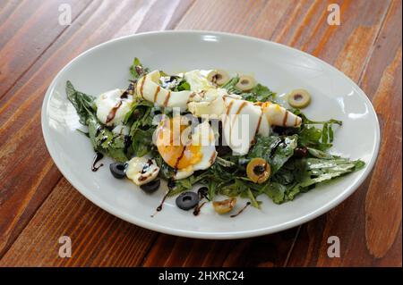 Closeup of Wild Garlic, Spinach, Potato and Egg Salad Bowl Stock Photo
