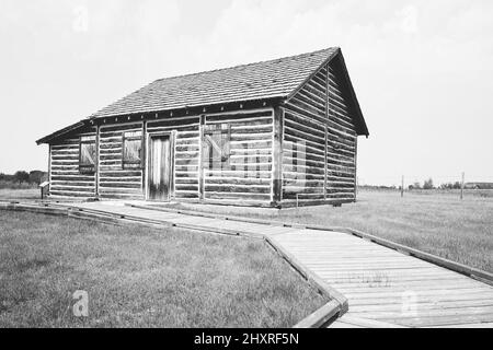 A reconstructed buildings of wood and chink of a trading post from early 1800s Stock Photo