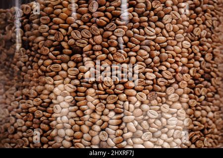 coffee beans pattern. roasted coffee beans in glass jar. coffee beans background. endless coffee texture. seamless background. Stock Photo