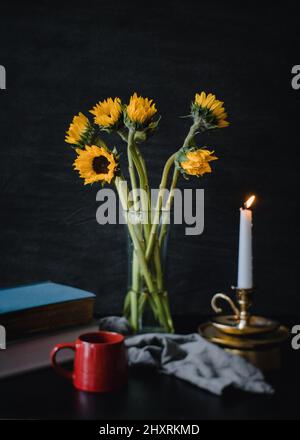 Coffee and sunflowers on the table Stock Photo