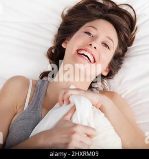 Young woman Happiness after waking up Stock Photo