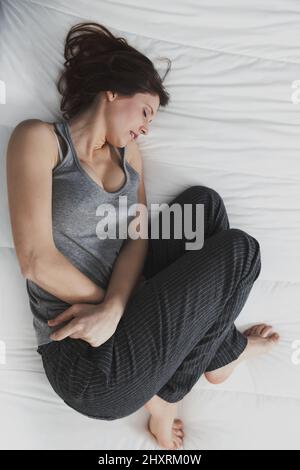 young woman suffering with PMS pain Stock Photo