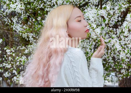 Asian Girl With Spring Flowers Stock Photo