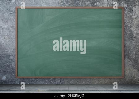 Blackboard texture. Empty blank green chalkboard with chalk traces.  Concrete background. Stock Photo