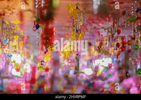Artificial flowers and decorations of different colors Stock Photo