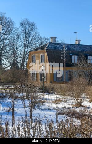 Beautiful Swedish buildings taken from around the country and rebuilt on an island to form the world's first open air museum Skansen, opening in 1891. Stock Photo