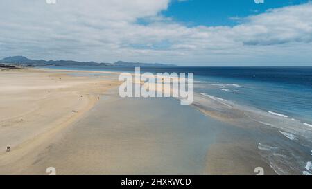Beautiful nature landscape viewed from air with yellow sand tropical beach and blu ocean and sky. Tourist scenic place and travel destination for summ Stock Photo