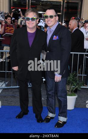 Elton John and David Furnish at the 'Gnomeo and Juliet' World Premiere, held at the El Capitan Theatre, Hollywood. Stock Photo