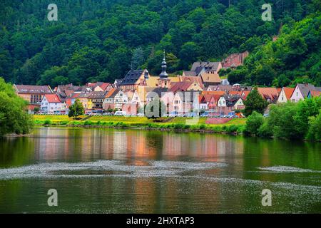Beautiful view of waterfront historical buildings against a cloudy sky in Freudenberg, Germany Stock Photo