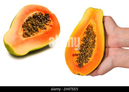Papaya fruit isolated on a white background in woman hands. Tropical fruit. Half papaya. Stock Photo