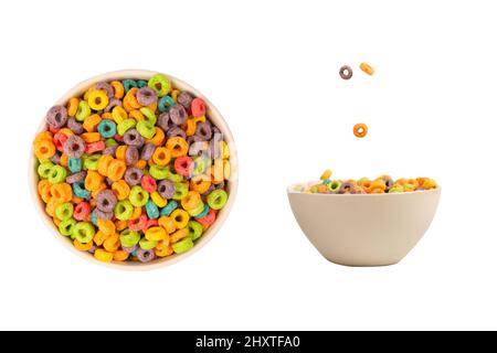 Colorful rings cereal spill out into a bowl. Breakfast. Isolated on a white background. Stock Photo