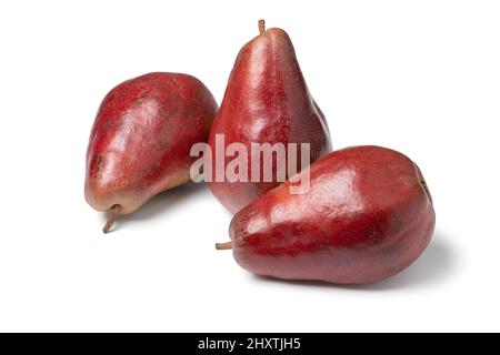 Threer whole fresh ripe Belgian sweet Red Modoc pears isolated on white background Stock Photo