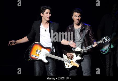 Nick Jonas and Kevin Jonas, of the Jonas Brothers performs during the 'Concert for Hope' held at Gibson Amphitheatre in Universal City, California Stock Photo