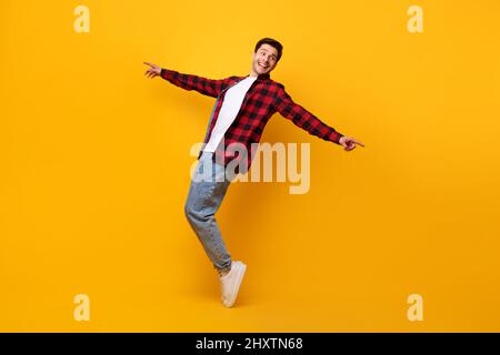 Smiling young man enjoying music dancing disco Stock Photo