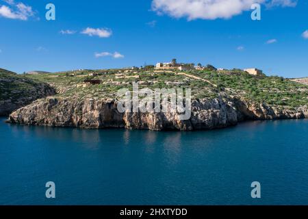 The bay and low cliffs of the drowned ria valley of Mgarr ix-Xini, in the island of Gozo, Malta Stock Photo