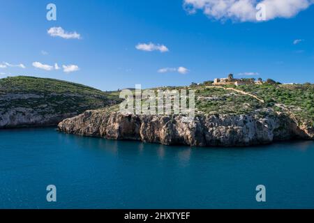 The bay and low cliffs of the drowned ria valley of Mgarr ix-Xini, in the island of Gozo, Malta Stock Photo