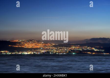 Tiberias city lights late at night on the Sea of Galilee Stock Photo