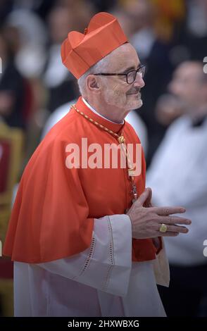Cardinal Michael Czerny chose a cross made with wood from the cross as a coat of arms, it comes from a boat used to cross the Mediterranean sea and arrive to Lampedusa by migrants. The plaque behind shows the word Suscipe, which means to receive. Pope Francis appoints 13 new cardinals at the 2019 Ordinary Public Consistory, choosing prelates whose lifelong careers reflect their commitment to serve the marginalized and local church communities, hailing from 11 different nations and representing multiple religious orders. Stock Photo