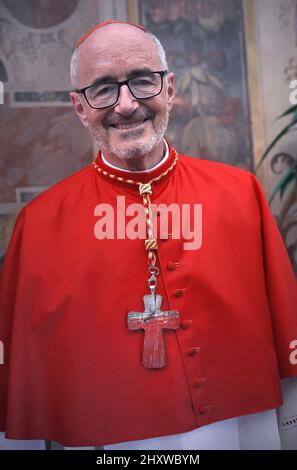 Cardinal Michael Czerny chose a cross made with wood from the cross as a coat of arms, it comes from a boat used to cross the Mediterranean sea and arrive to Lampedusa by migrants. The plaque behind shows the word Suscipe, which means to receive. Pope Francis appoints 13 new cardinals at the 2019 Ordinary Public Consistory, choosing prelates whose lifelong careers reflect their commitment to serve the marginalized and local church communities, hailing from 11 different nations and representing multiple religious orders. Stock Photo