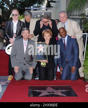 Peter Asher, Leron Gubler, Phil Everly, Gary Busey, Maria Elena Holly, Tom LaBonge and Marty Shelton pose as Buddy Holly is honored on the Hollywood Walk of Fame in front of the Capital Records Building, Hollywood, California on September 07, 2011. Stock Photo