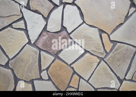 The wall lined with decorative stone. Abstract stone background Stock Photo