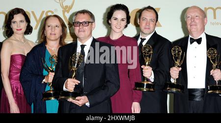 Michelle Dockery and the cast of Downton Abbey in the press room during the 63rd Annual Primetime Emmy Awards held at Nokia Theatre L.A. in Los Angeles, California, USA. Stock Photo