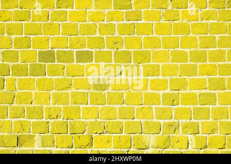 Yellow brick wall. Background of an old brick building. The ancient masonry, brickwork. Stock Photo