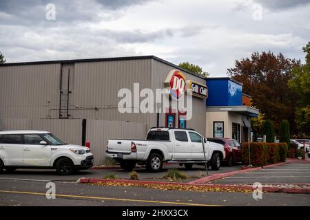 Redmond, WA USA - circa October 2021: Angled view of cars in the drive thru line at a Dairy Queen fast food restaurant. Stock Photo