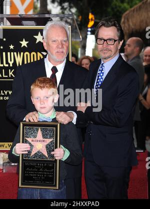 Malcolm McDowell, son Beckett McDowell and Gary Oldman as Malcolm McDowell is honored with a star on the Hollywood Walk of Fame Star Ceremony in Los Angeles, USA. Stock Photo