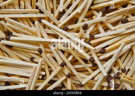 Lots of wooden matches texture. Abstract background of new wooden matches. Stock Photo