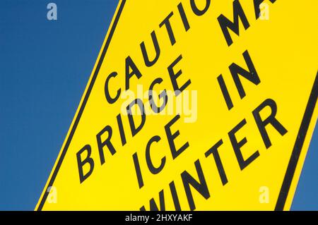 Freeway and road signs on the shoulder of the roadway bed Stock Photo