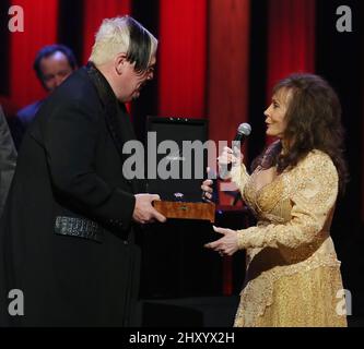 Loretta Lynn and Grand Ole Opry General Manager Pete Fisher and Johnathon Arndt attending Loretta Lynn's 50th Grand Ole Opry Anniversary at the Grand Ole Opry House, Tennessee. Stock Photo