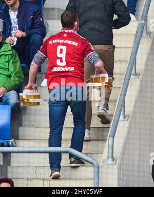 FCB fan with beer in the stadium in the match TSG 1899 HOFFENHEIM - FC BAYERN MÜNCHEN 1-1 1.German Football League on Mar 12, 2022 in Sinsheim, Germany. Season 2021/2022, matchday 26, 1.Bundesliga, FCB, Muenchen, 26.Spieltag. © Peter Schatz / Alamy Live News    - DFL REGULATIONS PROHIBIT ANY USE OF PHOTOGRAPHS as IMAGE SEQUENCES and/or QUASI-VIDEO - Stock Photo