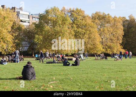 London, United Kingdom - October 29, 2017: People rest at St James Park on a sunny day Stock Photo
