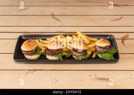 A slider is an American term for a small burger, usually around 2 inches wide, made with a bun Stock Photo