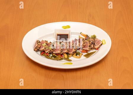 In the preparations in which raw tuna is consumed, such as in a tataki, it is important to use some acid that contributes to guaranteeing the healthin Stock Photo