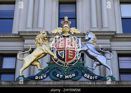 Royal coat of arms of the United Kingdom, featuring a lion and a unicorn, on a state government building in Melbourne's treasury precinct Stock Photo